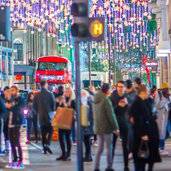 People shopping on a high street.